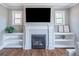 Elegant fireplace with built-in shelving, providing a cozy focal point in the living space at 2675 Sugar Mill Dr, Atlanta, GA 30316