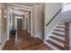Inviting foyer with hardwood floors, staircase, and view of the front door at 2675 Sugar Mill Dr, Atlanta, GA 30316