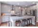 Modern kitchen featuring gray cabinets, granite countertops, stainless steel appliances, and pendant lighting at 2675 Sugar Mill Dr, Atlanta, GA 30316