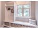 Convenient mudroom area with built-in bench, storage cubbies, and coat hooks at 2675 Sugar Mill Dr, Atlanta, GA 30316