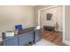 Well-appointed office with modern desk, bench, and hardwood floors at 2675 Sugar Mill Dr, Atlanta, GA 30316