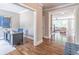 View from office to the living room, showcasing the open floor plan and hardwood floors at 2675 Sugar Mill Dr, Atlanta, GA 30316