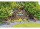 Community entrance sign for Eastside Walk surrounded by lush landscaping at 2675 Sugar Mill Dr, Atlanta, GA 30316