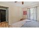 Cozy bedroom features a bed, hardwood floors, and a window for natural light at 4076 Blanton Sw Ave, Atlanta, GA 30331