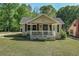 Charming bungalow featuring a cozy front porch and inviting curb appeal at 4076 Blanton Sw Ave, Atlanta, GA 30331