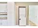 Convenient laundry area with stacked washer and dryer and additional storage space at 4076 Blanton Sw Ave, Atlanta, GA 30331