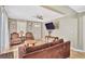 Cozy living room with hardwood floors, a ceiling fan, and a TV mounted on the wall at 4076 Blanton Sw Ave, Atlanta, GA 30331