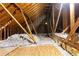 Insulated attic with exposed wood framing, providing a view of the home's structure at 415 Morgan Falls Chase, Canton, GA 30114