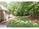 A lush, green backyard with a wooden deck, perfect for outdoor gatherings and relaxation at 415 Morgan Falls Chase, Canton, GA 30114
