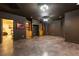 A large, open basement, has built-in shelving, creating an adaptable living space for various uses at 415 Morgan Falls Chase, Canton, GA 30114