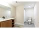 A bathroom featuring a double sink vanity, tiled floors, toilet and shower, blending functionality with sleek design at 415 Morgan Falls Chase, Canton, GA 30114
