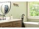 Modern bathroom vanity featuring and sink, modern faucet, and mounted mirror at 415 Morgan Falls Chase, Canton, GA 30114