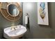 Elegant bathroom with a decorative mirror and stylish sink at 415 Morgan Falls Chase, Canton, GA 30114