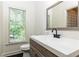 Bathroom with a window providing natural light, a modern vanity, and sleek fixtures at 415 Morgan Falls Chase, Canton, GA 30114