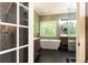 Ensuite bathroom featuring modern fixtures, large soaking tub, and glass shower enclosure at 415 Morgan Falls Chase, Canton, GA 30114