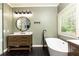 Ensuite bathroom featuring modern fixtures, large soaking tub, and glass shower enclosure at 415 Morgan Falls Chase, Canton, GA 30114