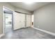 An empty bedroom area shows doorway to bathroom, an adjacent room, and a closet for versatile use at 415 Morgan Falls Chase, Canton, GA 30114