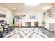 A versatile bedroom space has a desk area, a hanging swing chair, and a rocking chair, great for relaxing at 415 Morgan Falls Chase, Canton, GA 30114