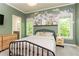 Tastefully decorated bedroom with lots of natural light and neutral colors at 415 Morgan Falls Chase, Canton, GA 30114