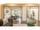 Elegant dining room with hardwood floors, gray trim, a modern chandelier, and large windows overlooking a green yard at 415 Morgan Falls Chase, Canton, GA 30114