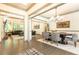 Open-concept dining room adjacent to the living area with stylish furniture and hardwood floors at 415 Morgan Falls Chase, Canton, GA 30114