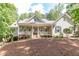 Beautiful home with a classic front porch and well-maintained landscaping at 415 Morgan Falls Chase, Canton, GA 30114