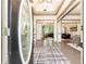 Elegant foyer with hardwood floors and an open view to the living and dining areas at 415 Morgan Falls Chase, Canton, GA 30114