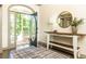 Bright foyer area, with an open door, and console table at 415 Morgan Falls Chase, Canton, GA 30114
