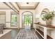 Bright and airy foyer featuring a console table, hardwood floors, and an inviting entrance at 415 Morgan Falls Chase, Canton, GA 30114