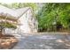 A home with a two car garage and a basketball court on the driveway at 415 Morgan Falls Chase, Canton, GA 30114