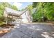 Spacious driveway leading to a two-car garage, with a basketball hoop adding to the home's appeal at 415 Morgan Falls Chase, Canton, GA 30114