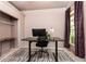 Well-lit home office with desk, black chair, and large windows for natural light at 415 Morgan Falls Chase, Canton, GA 30114