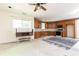 A kitchen with oak cabinets, countertops, and appliances awaits renovation to become the heart of the home at 415 Morgan Falls Chase, Canton, GA 30114