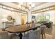 Open-concept living room and dining area with fireplace, built-in bookshelves, and plenty of seating at 415 Morgan Falls Chase, Canton, GA 30114