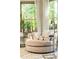 Cozy living room featuring a round chair, natural light, and a side table at 415 Morgan Falls Chase, Canton, GA 30114