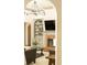 Open-concept living area featuring a fireplace, built-in shelves, large archway, and modern lighting fixtures at 415 Morgan Falls Chase, Canton, GA 30114