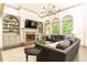Inviting living room boasts a brick fireplace, built-in bookshelves, and comfortable seating at 415 Morgan Falls Chase, Canton, GA 30114