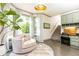 Inviting living room with lots of windows, a cozy round chair and built-in desk at 415 Morgan Falls Chase, Canton, GA 30114