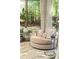 Inviting living room featuring a plush chair, views of the outdoors, and cozy lighting at 415 Morgan Falls Chase, Canton, GA 30114