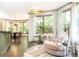 Open-concept living area with hardwood floors, round chair, and views of the outdoors at 415 Morgan Falls Chase, Canton, GA 30114
