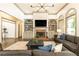 Bright living room with a brick fireplace, built-in shelves, and two gray couches at 415 Morgan Falls Chase, Canton, GA 30114