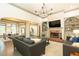 Open living space with fireplace, built-in shelves, and view into the dining area at 415 Morgan Falls Chase, Canton, GA 30114