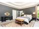 Bedroom with decorative rug, sitting area, and doorway access to ensuite bathroom at 415 Morgan Falls Chase, Canton, GA 30114