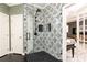 Walk in shower with modern black and white accent tile and black shower fixtures at 415 Morgan Falls Chase, Canton, GA 30114