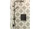 Close up of walk in shower with modern black and white accent tile and black shower fixtures at 415 Morgan Falls Chase, Canton, GA 30114