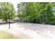 Community sand volleyball court with a surrounding green space and nearby playground at 415 Morgan Falls Chase, Canton, GA 30114