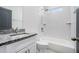 Modern bathroom features a tub with white subway tile and granite vanity at 100 Dahlia Nw Ave, Atlanta, GA 30314