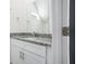 Well-lit bathroom featuring granite counters, white cabinets and contemporary fixtures at 100 Dahlia Nw Ave, Atlanta, GA 30314