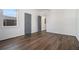 Comfortable bedroom featuring hardwood floors, light walls, and window light at 100 Dahlia Nw Ave, Atlanta, GA 30314