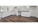 Modern kitchen showcasing granite countertops, white cabinetry, and spacious layout at 100 Dahlia Nw Ave, Atlanta, GA 30314